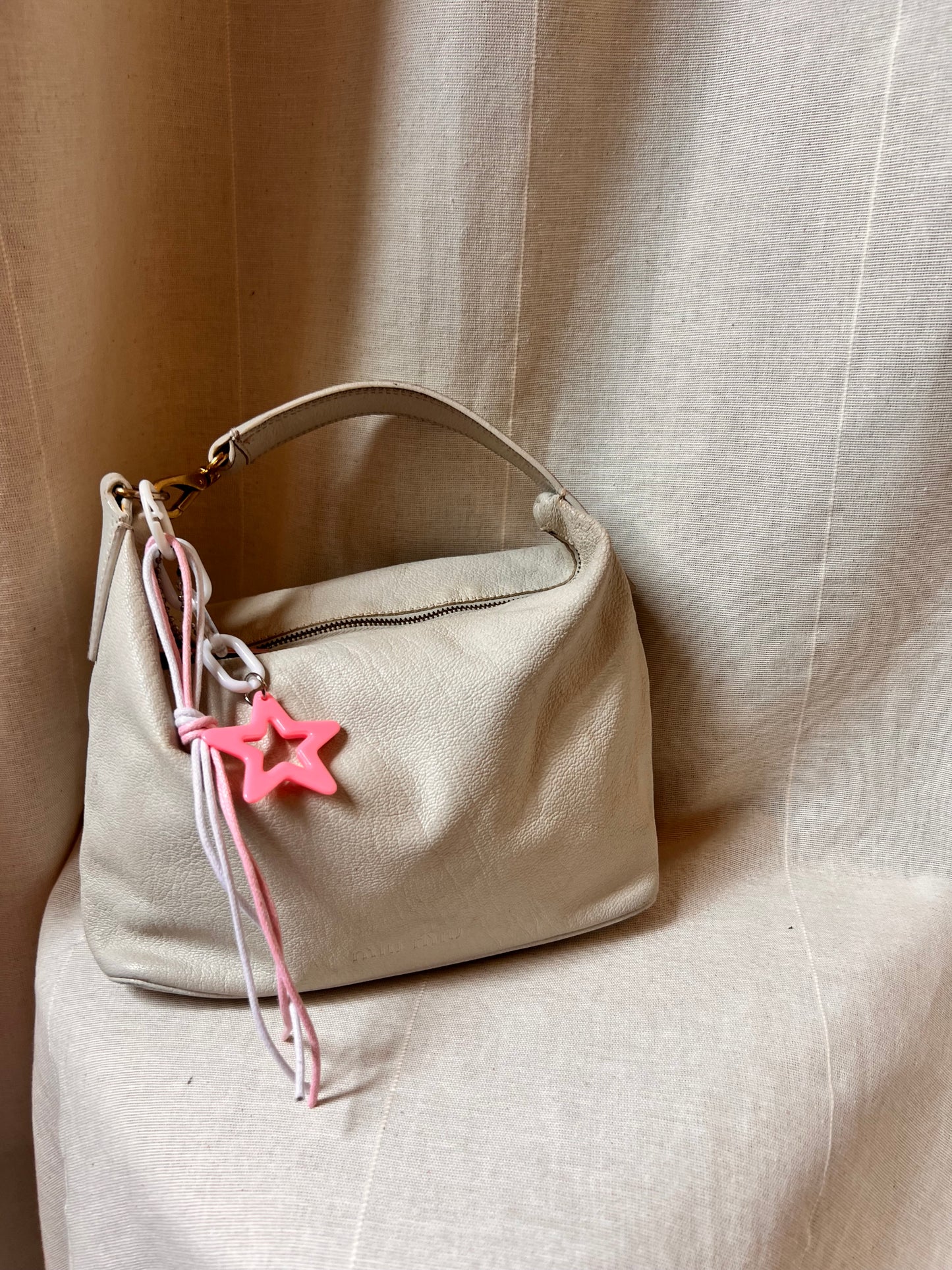 Iconic Miu Miu logo bag