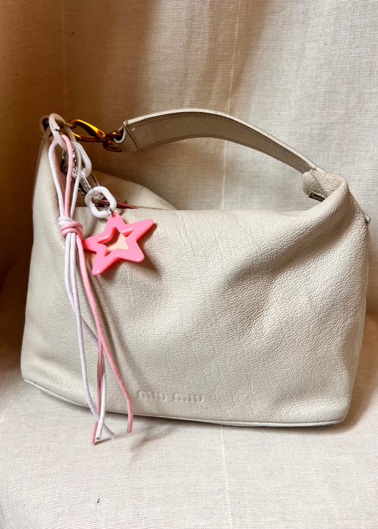 Iconic Miu Miu logo bag